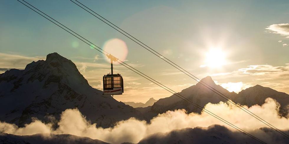 Sky, Cloud, Atmospheric phenomenon, Cable car, Snow, Winter, Sunlight, Atmosphere, Mountain, Photography, 
