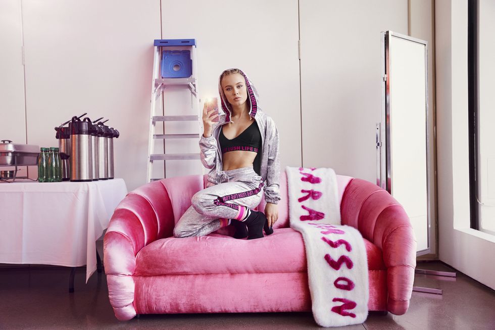 Pink, Couch, Furniture, Beauty, Room, Blond, Fashion, Sitting, Leg, Interior design, 