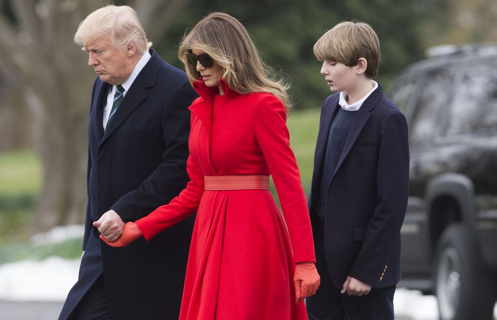 US President Donald Trump, First Lady Melania Trump and their son, Barron, walk to Marine One