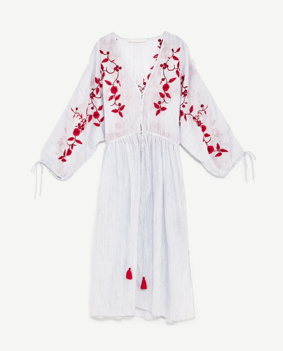 White, Clothing, Robe, Sleeve, Outerwear, Costume, Font, Dress, Embroidery, Neck, 