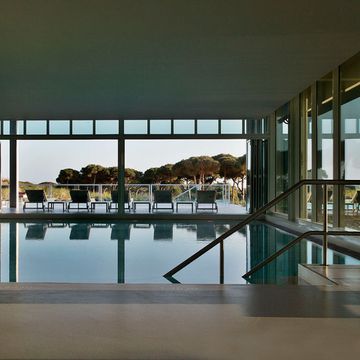 Reflection, Glass, Swimming pool, Real estate, Resort, Shade, Daylighting, Composite material, Transparent material, Aqua, 