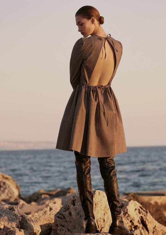 Clothing, Outerwear, Fashion, Brown, Standing, Human, Coat, Sea, Photography, Footwear, 