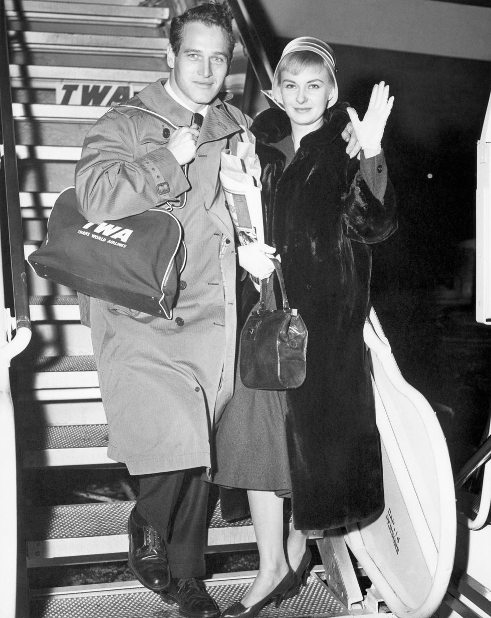 <p>American actors Paul Newman and Joanne Woodward prepare to board a Jetstream flight to London for a month-long honeymoon.</p>