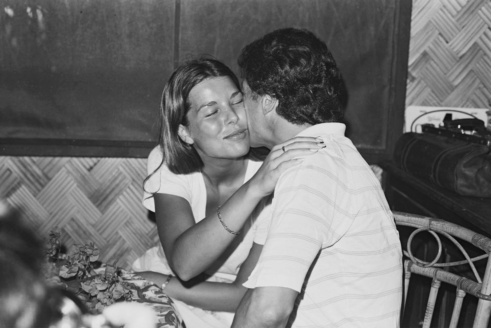 <p>Princess Caroline of Monaco and her first husband Philippe Junot kiss during their honeymoon in French Polynesia in the South Pacific.</p>