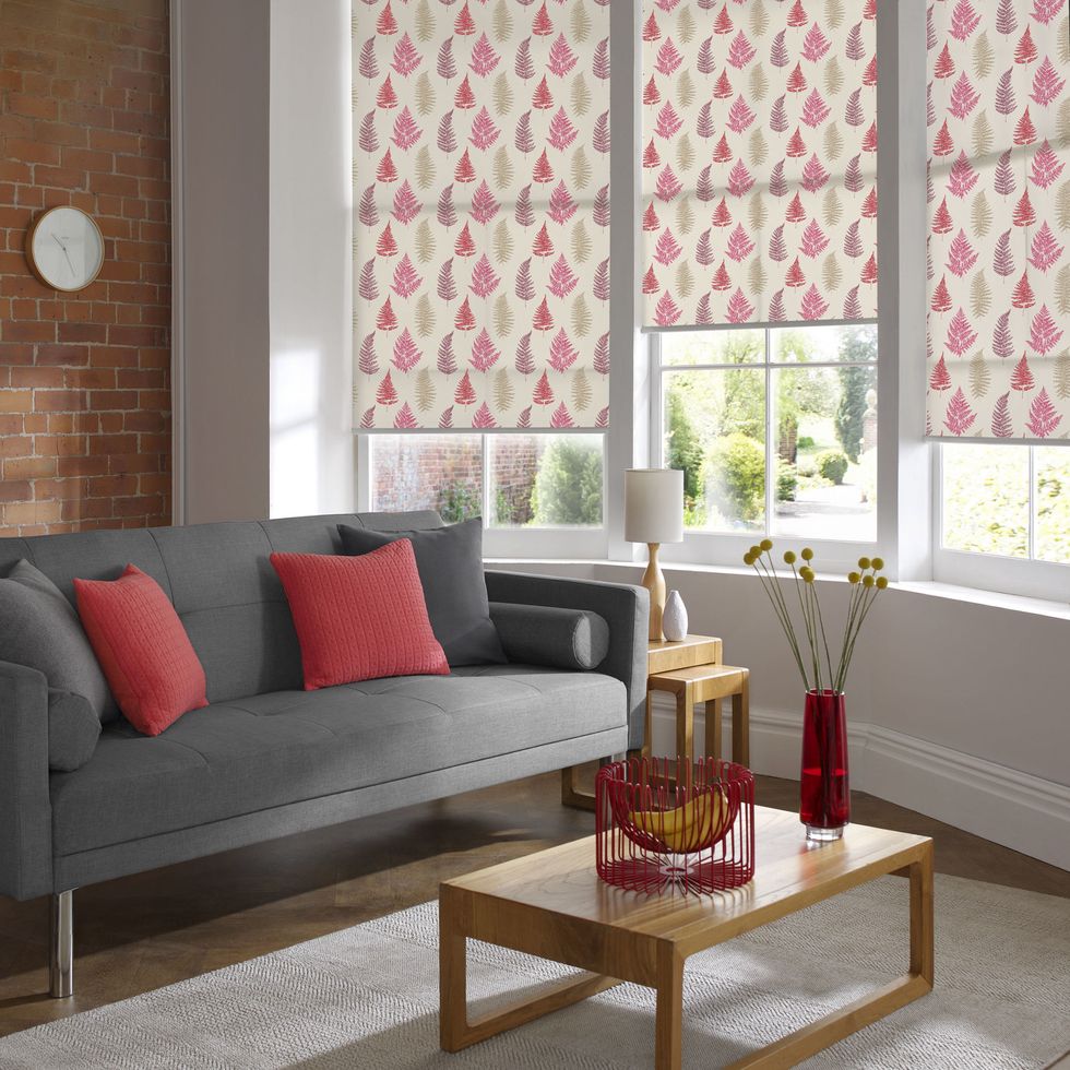 Curtain, Living room, Interior design, Furniture, Room, Red, Window treatment, Window covering, Couch, Coffee table, 
