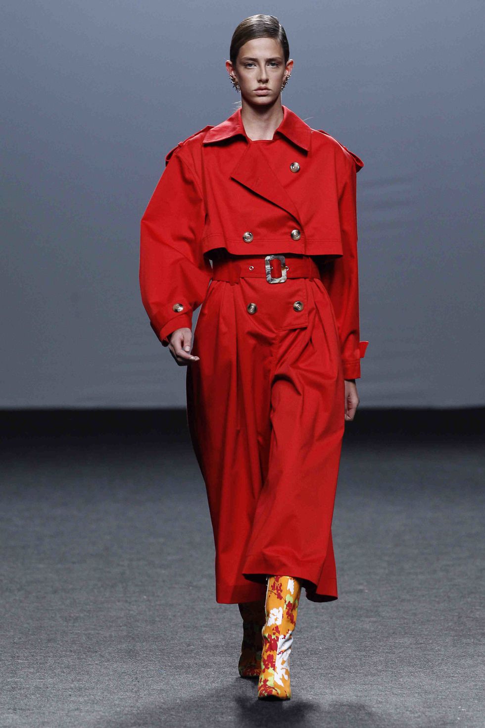 Fashion model, Clothing, Fashion, Runway, Red, Fashion show, Trench coat, Coat, Overcoat, Outerwear, 