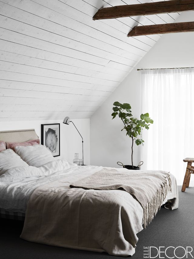 Dormitorio elegante decorado en gris