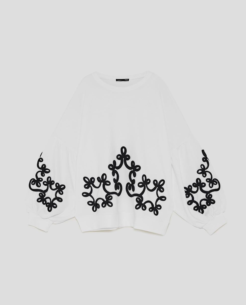 White, Clothing, Outerwear, Font, Sleeve, Neck, Black-and-white, Pattern, 