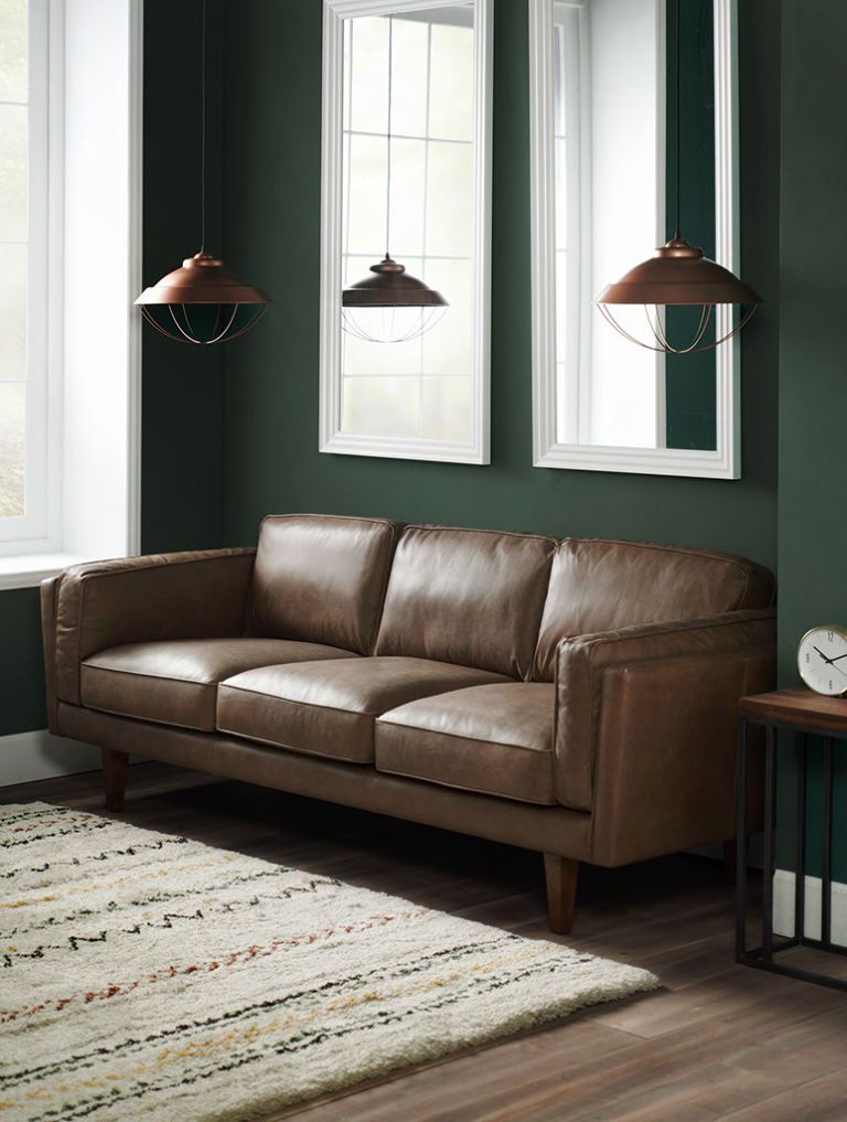 Furniture, Couch, Room, Floor, Interior design, Living room, Brown, Wood flooring, Laminate flooring, Lighting, 