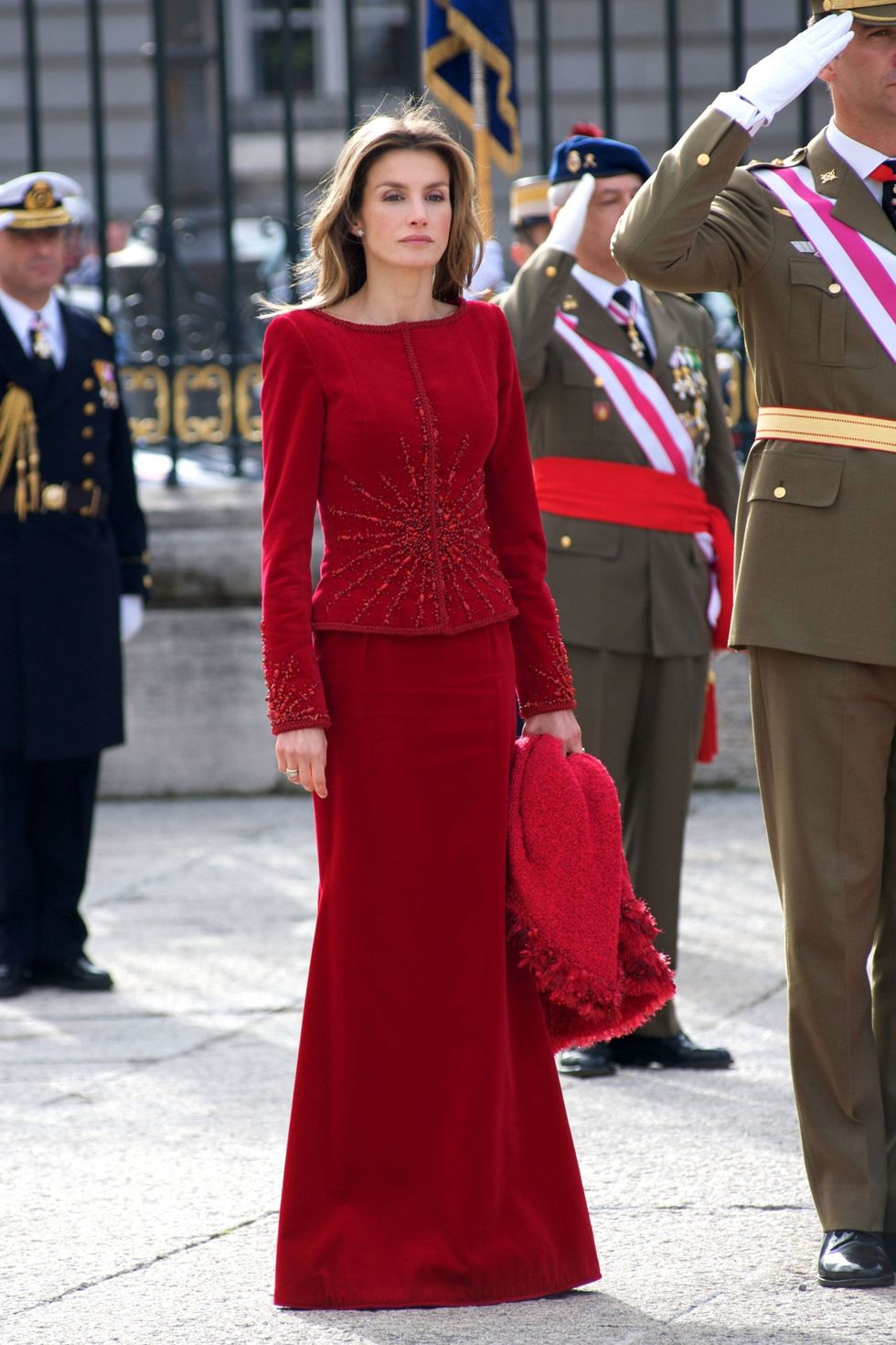 Red, Clothing, Fashion, Dress, Street fashion, Standing, Shoulder, Uniform, Event, Haute couture, 
