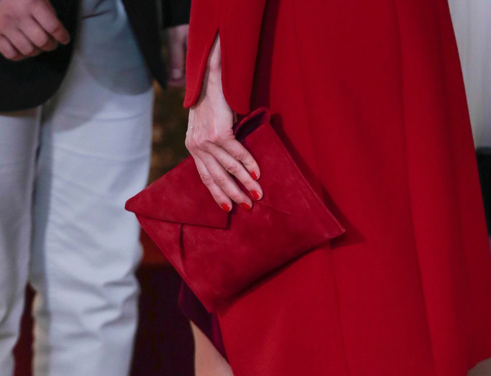 Red, Maroon, Fashion, Outerwear, Hand, Haute couture, Dress, Gesture, Magenta, Formal wear, 