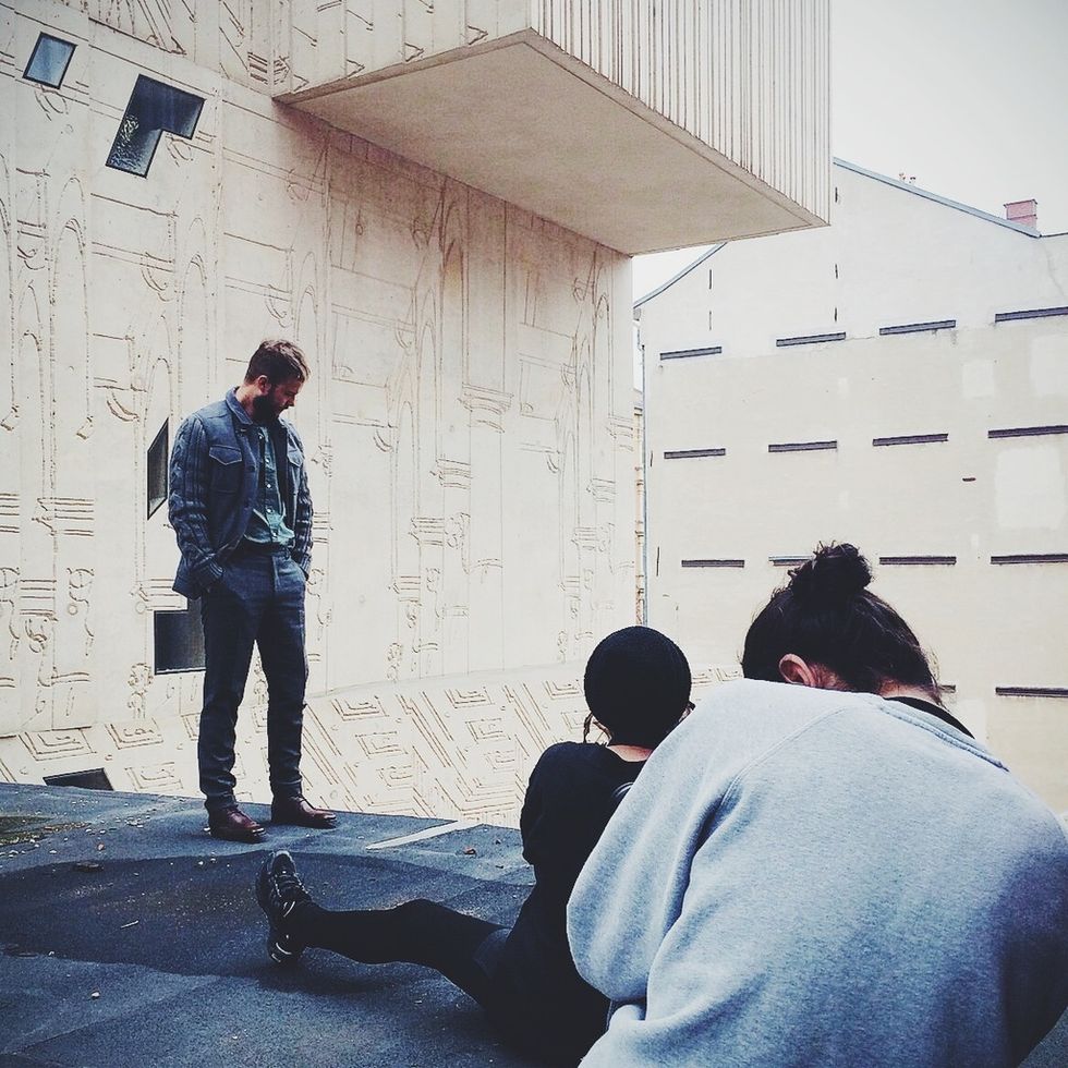 Human body, Trousers, Wall, Jeans, Denim, Street fashion, Shadow, Back, Conversation, Concrete, 