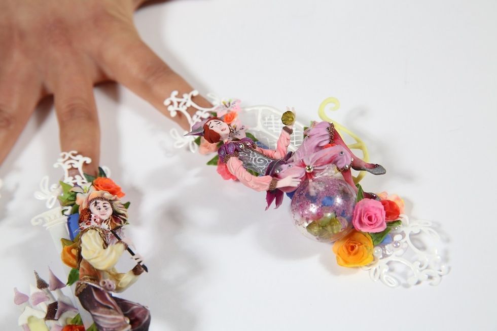Finger, Wrist, Fashion accessory, Nail, Cut flowers, Toy, Creative arts, Artificial flower, Ring, Body jewelry, 