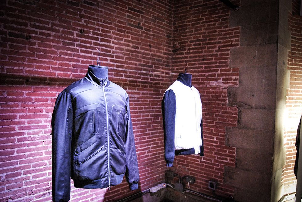 Sleeve, Collar, Brick, Clothes hanger, Majorelle blue, Jacket, Brickwork, Electric blue, Leather jacket, Top, 