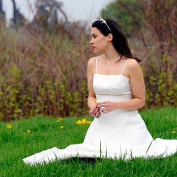 Clothing, Grass, Dress, Shoulder, Photograph, People in nature, Bride, Wedding dress, Bridal clothing, Sitting, 