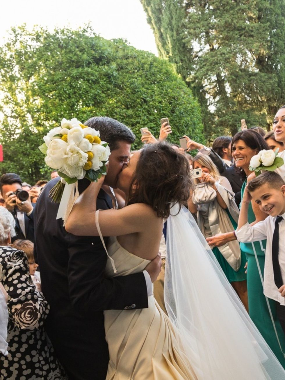 Event, Tradition, Bridal clothing, Petal, Suit, Ceremony, Crowd, Wedding dress, Dress, Bouquet, 