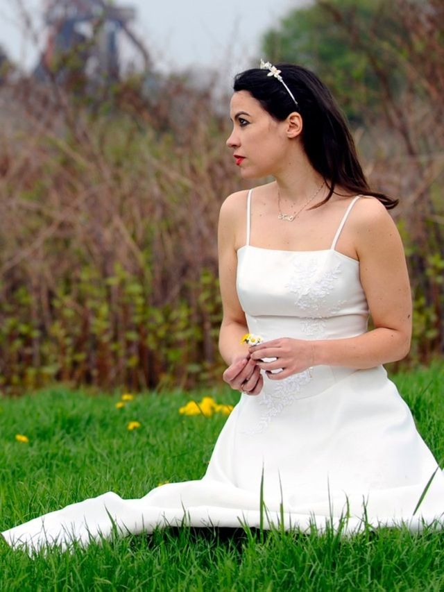 Clothing, Grass, Dress, Shoulder, Photograph, People in nature, Bride, Wedding dress, Bridal clothing, Sitting, 