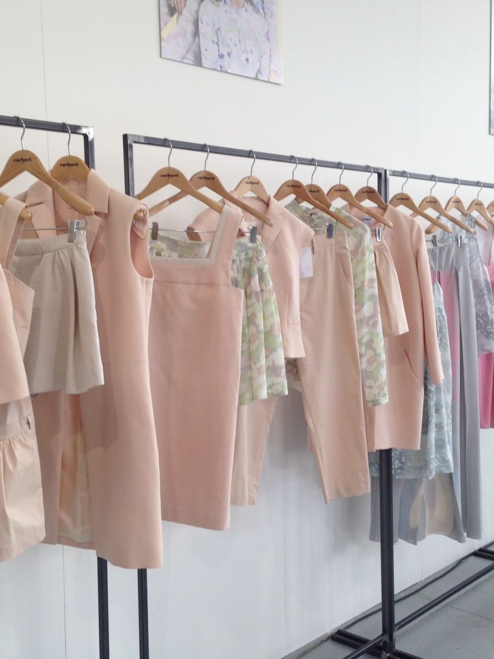Textile, Pink, Clothes hanger, Beige, Peach, Fashion design, Collection, Home accessories, Day dress, Boutique, 