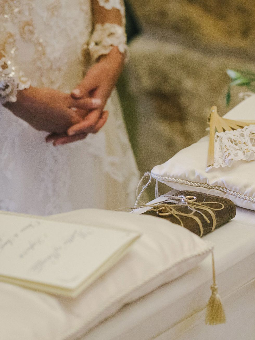 Bridal clothing, Petal, Wedding dress, Ceremony, Ivory, Bride, Marriage, Bridal accessory, Ritual, Wedding ceremony supply, 