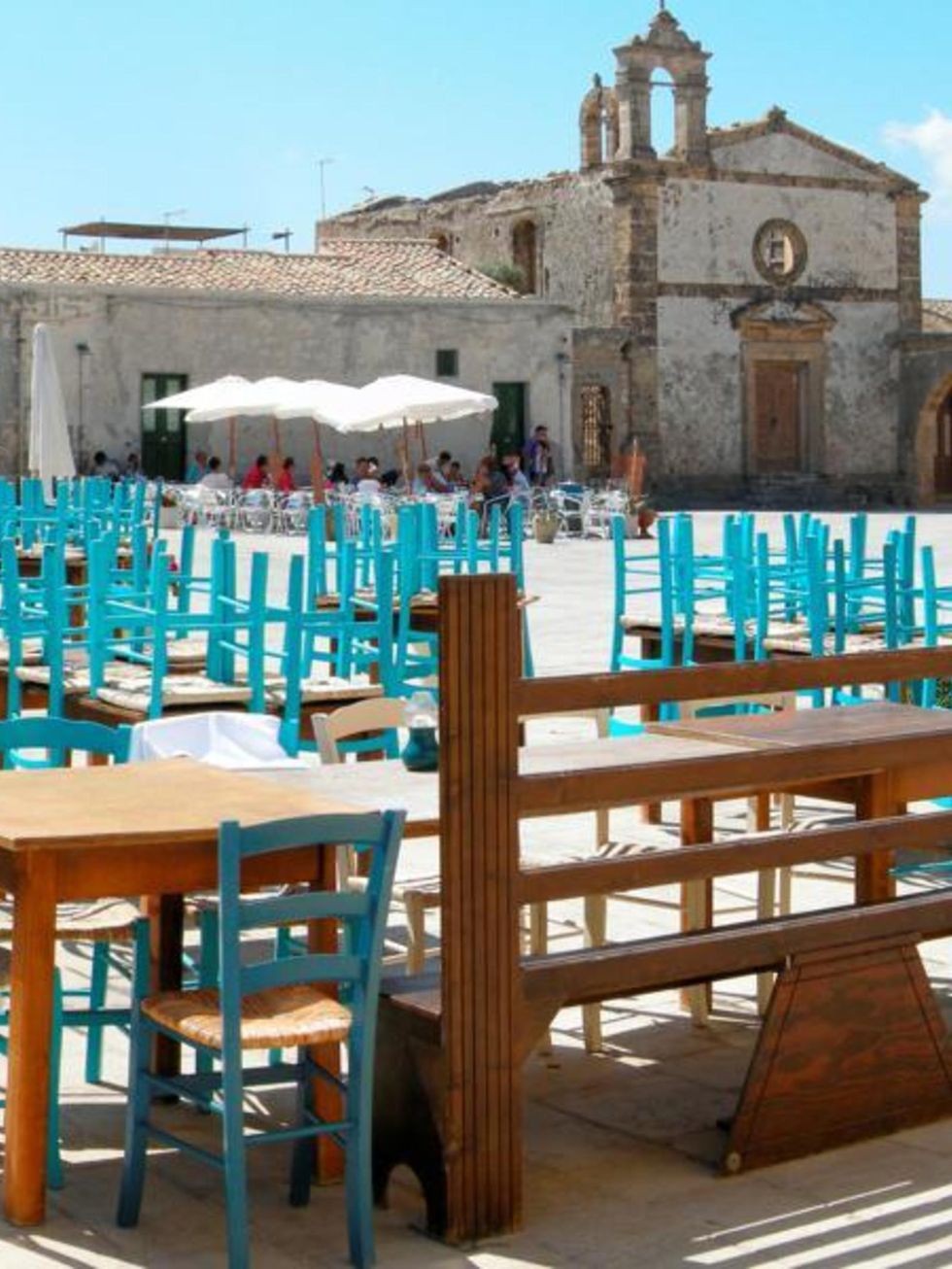 Turquoise, Teal, Hardwood, Outdoor table, Arch, Historic site, Medieval architecture, Outdoor furniture, Place of worship, 