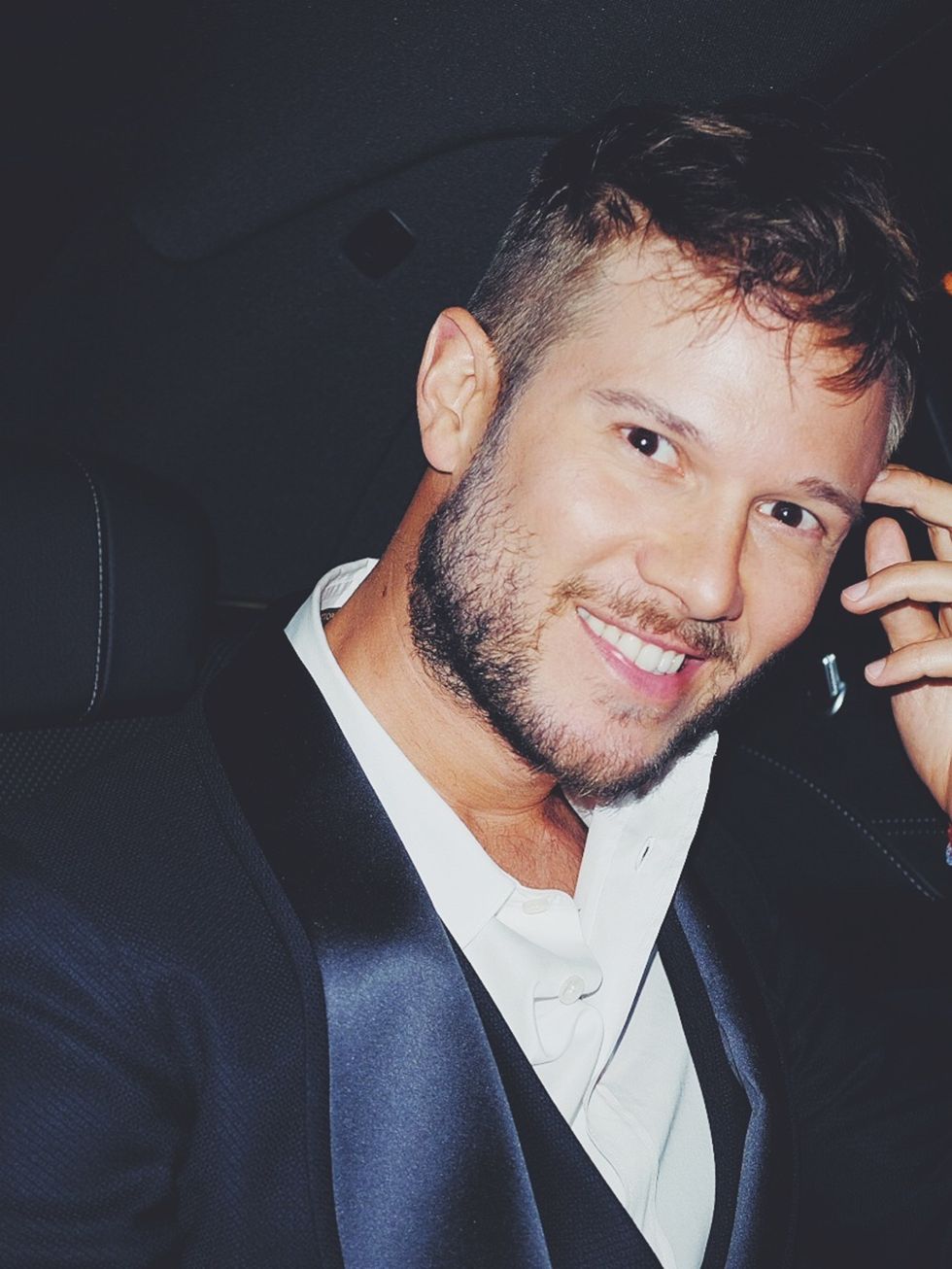 Outerwear, Facial hair, Jaw, Blazer, Cool, Tooth, Beard, Flash photography, Pleased, Thumb, 