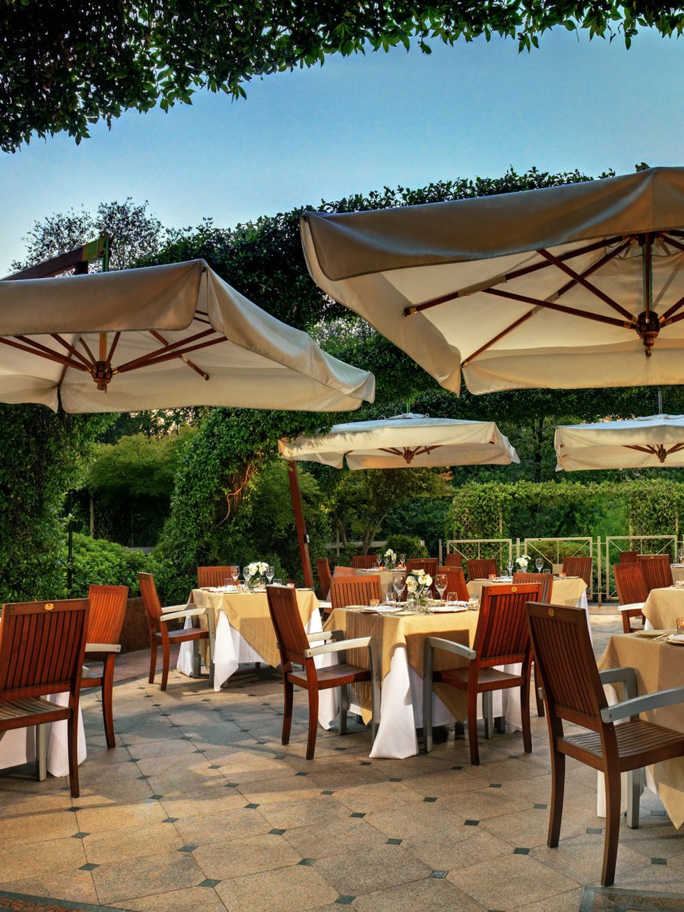 Furniture, Table, Chair, Outdoor table, Restaurant, Shade, Outdoor furniture, Function hall, Linens, Outdoor structure, 