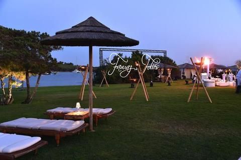 Outdoor furniture, Gazebo, Shade, Roof, Pavilion, Evening, Outdoor table, Outdoor structure, Thatching, Resort, 