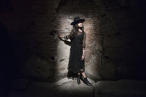Hat, Darkness, Sun hat, Tints and shades, Street fashion, Costume accessory, Flash photography, Boot, Fedora, Long hair, 