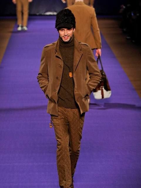 Human, Coat, Brown, Jacket, Trousers, Human body, Outerwear, Fashion show, Flooring, Style, 