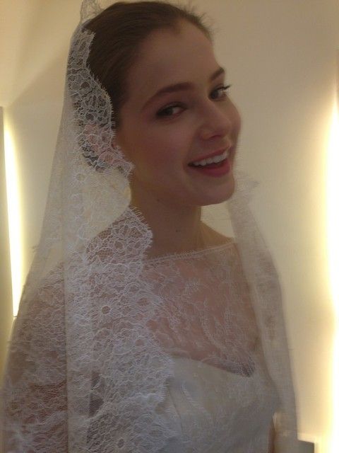 Clothing, Bridal veil, Bridal clothing, Hairstyle, Lighting, Veil, Sleeve, Forehead, Bridal accessory, Shoulder, 