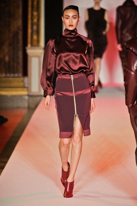 Leg, Fashion show, Sleeve, Shoulder, Runway, Human leg, Textile, Red, Joint, Waist, 