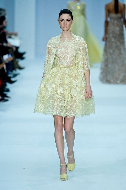 Clothing, Yellow, Fashion show, Event, Shoulder, Dress, Textile, Runway, Joint, Waist, 