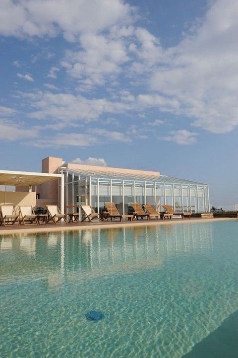 Fluid, Swimming pool, Resort, Real estate, Aqua, Azure, Resort town, Hotel, Seaside resort, Spa town, 