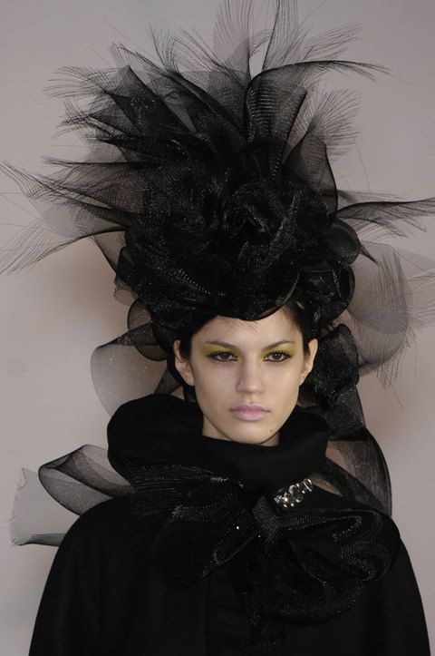 Headgear, Costume accessory, Black hair, Fashion, Black, Costume, Eyelash, Fur, Fashion model, Natural material, 