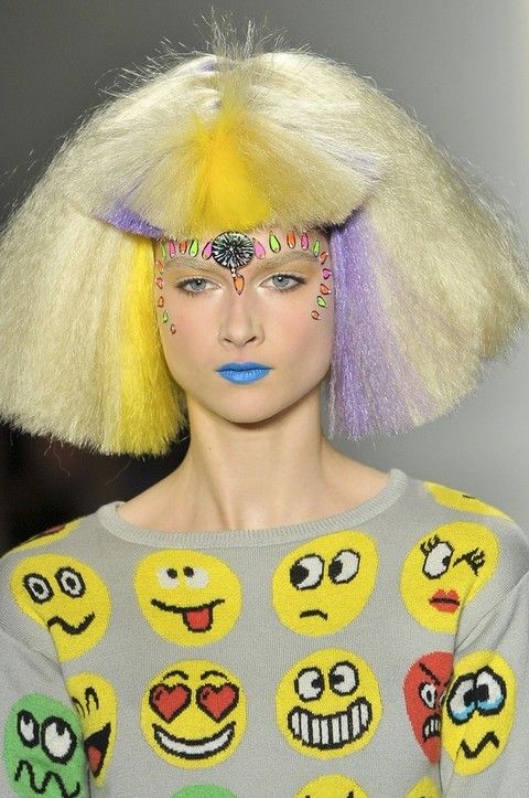 Lip, Yellow, Style, Eyelash, Costume accessory, Headgear, Art, Eye liner, Feather, Lipstick, 