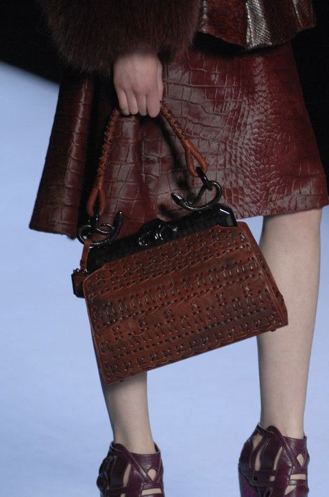 Brown, Human leg, Shoulder, Textile, Joint, Bag, Style, High heels, Fashion accessory, Leather, 