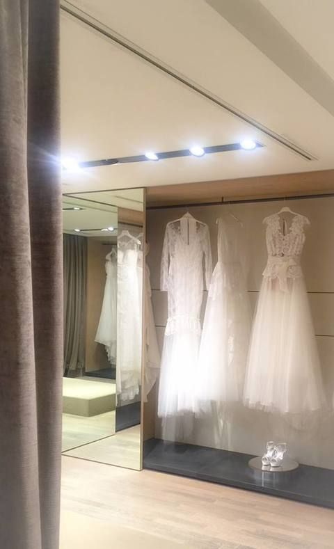 Textile, Dress, Floor, Interior design, Ceiling, Fixture, One-piece garment, Light fixture, Beige, Wedding dress, 