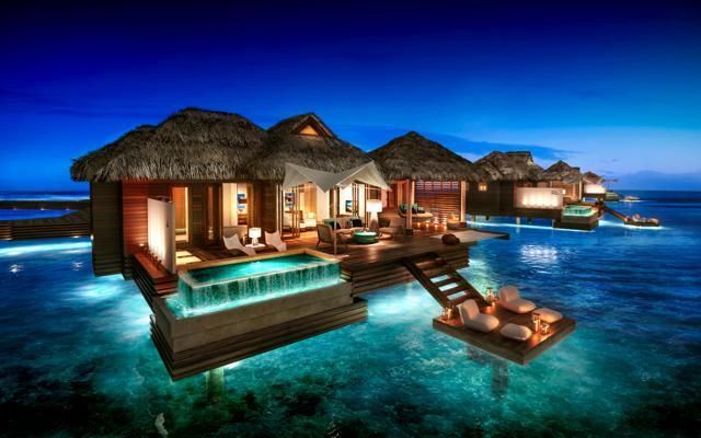 Resort, Real estate, Azure, Sunlounger, Outdoor furniture, Swimming pool, Ocean, Dusk, Seaside resort, Villa, 