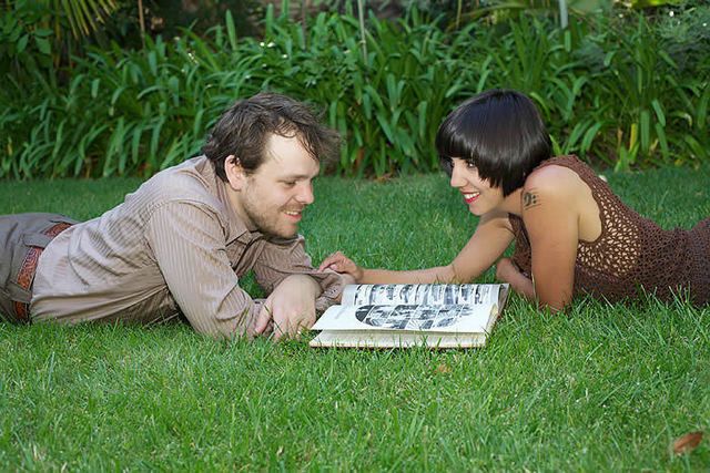 Grass, Mammal, People in nature, Adaptation, Sharing, Sitting, Black hair, Grass family, Groundcover, Love, 