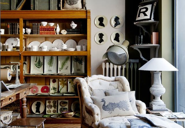 Shelf, Shelving, Room, Furniture, Collection, Pillow, Throw pillow, Lamp, Porcelain, Picture frame, 