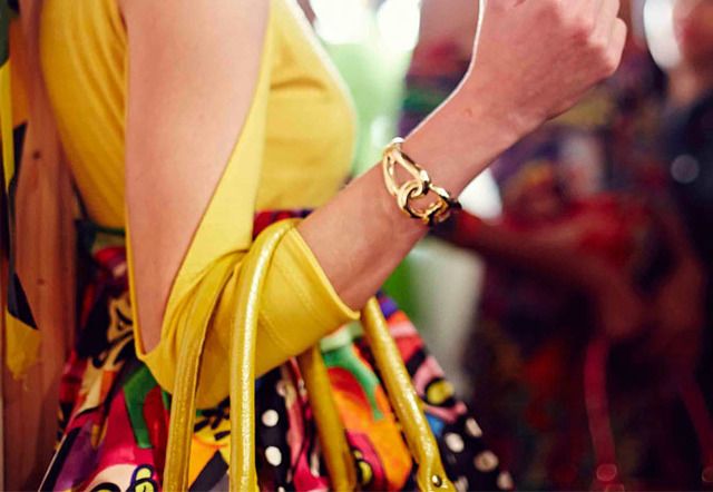 Yellow, Wrist, Fashion accessory, Interaction, Watch, Bracelet, Nail, Bangle, Tradition, 