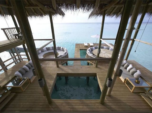 Resort, Swimming pool, Real estate, Seaside resort, Ocean, Outdoor furniture, Hardwood, Shade, Composite material, Caribbean, 