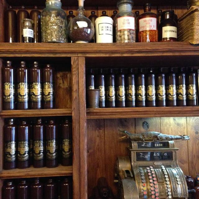 Shelf, Bottle, Shelving, Collection, Glass bottle, Alcoholic beverage, Alcohol, Bottle cap, Wood stain, Liquor store, 
