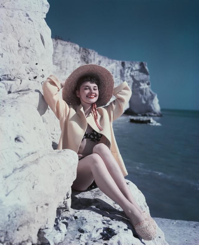 Coastal and oceanic landforms, Hat, Rock, Photograph, Summer, Sun hat, Beauty, Bedrock, Vacation, Sitting, 