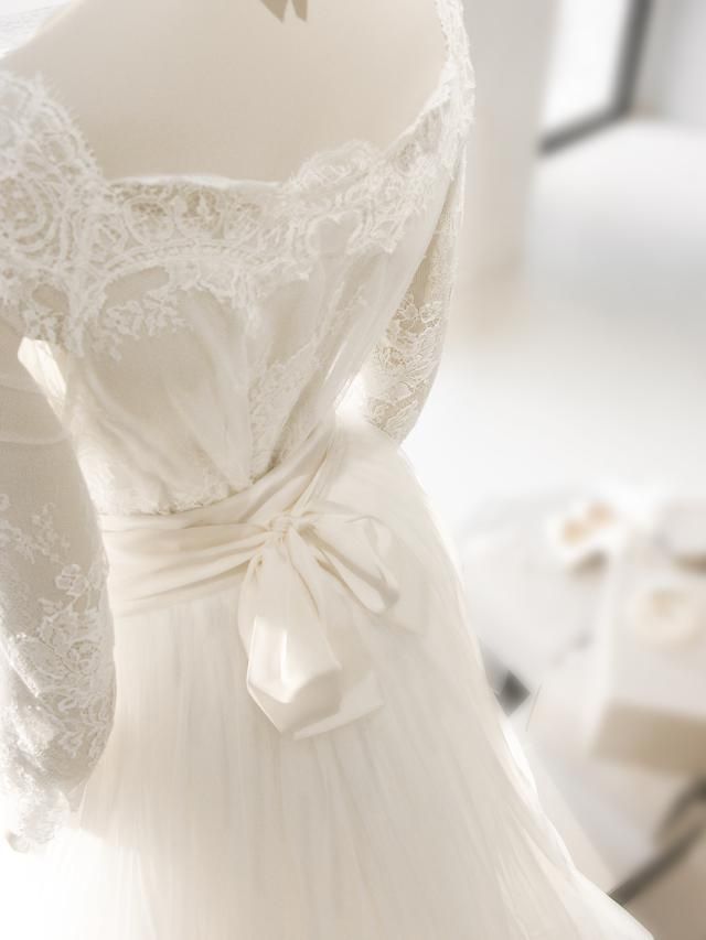 Bridal clothing, Bridal accessory, White, Dress, Gown, Wedding dress, One-piece garment, Embellishment, Bridal party dress, Day dress, 