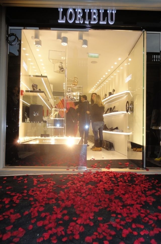 Lighting, Petal, Retail, Carmine, Display case, Display window, Carpet, Signage, Outlet store, Annual plant, 