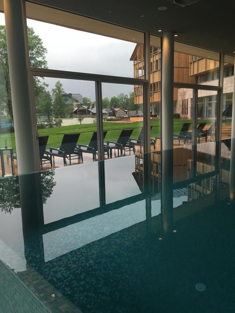 Real estate, Resort, Glass, Shade, Outdoor furniture, Outdoor table, Tile, Reflection, Eco hotel, Column, 