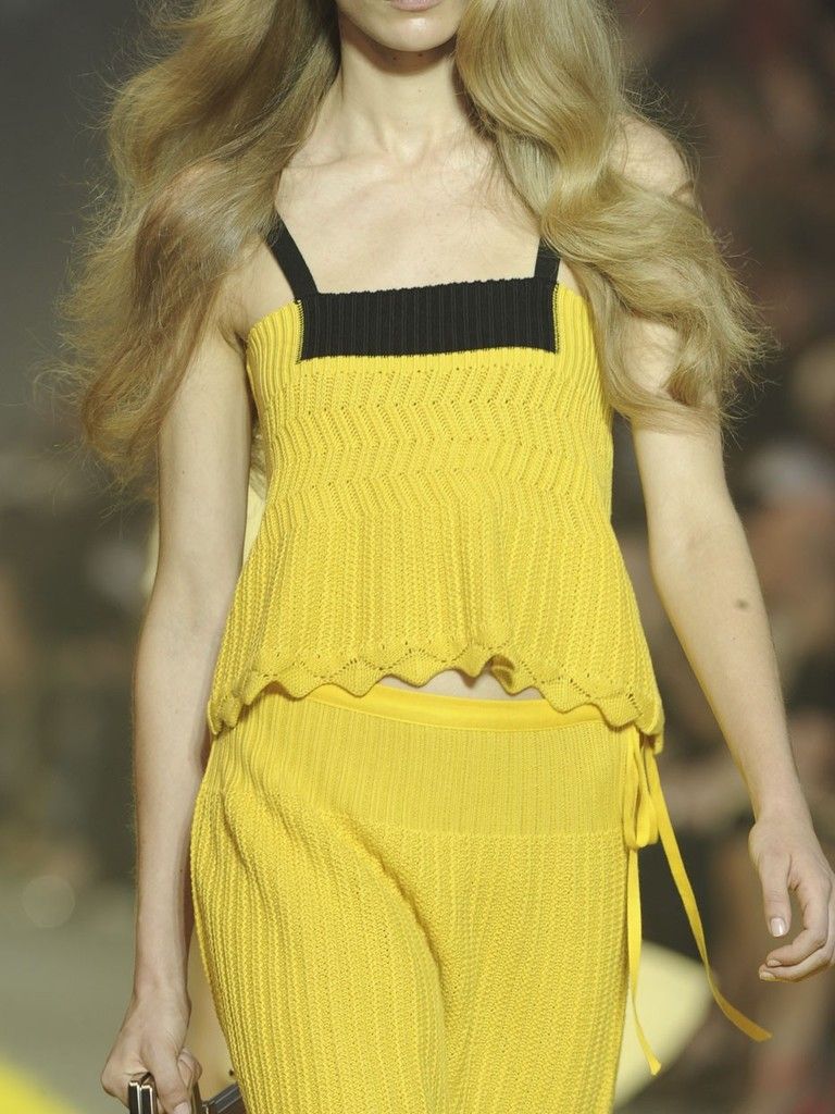 Yellow, Hairstyle, Shoulder, Dress, Joint, Amber, Fashion model, Waist, One-piece garment, Fashion, 