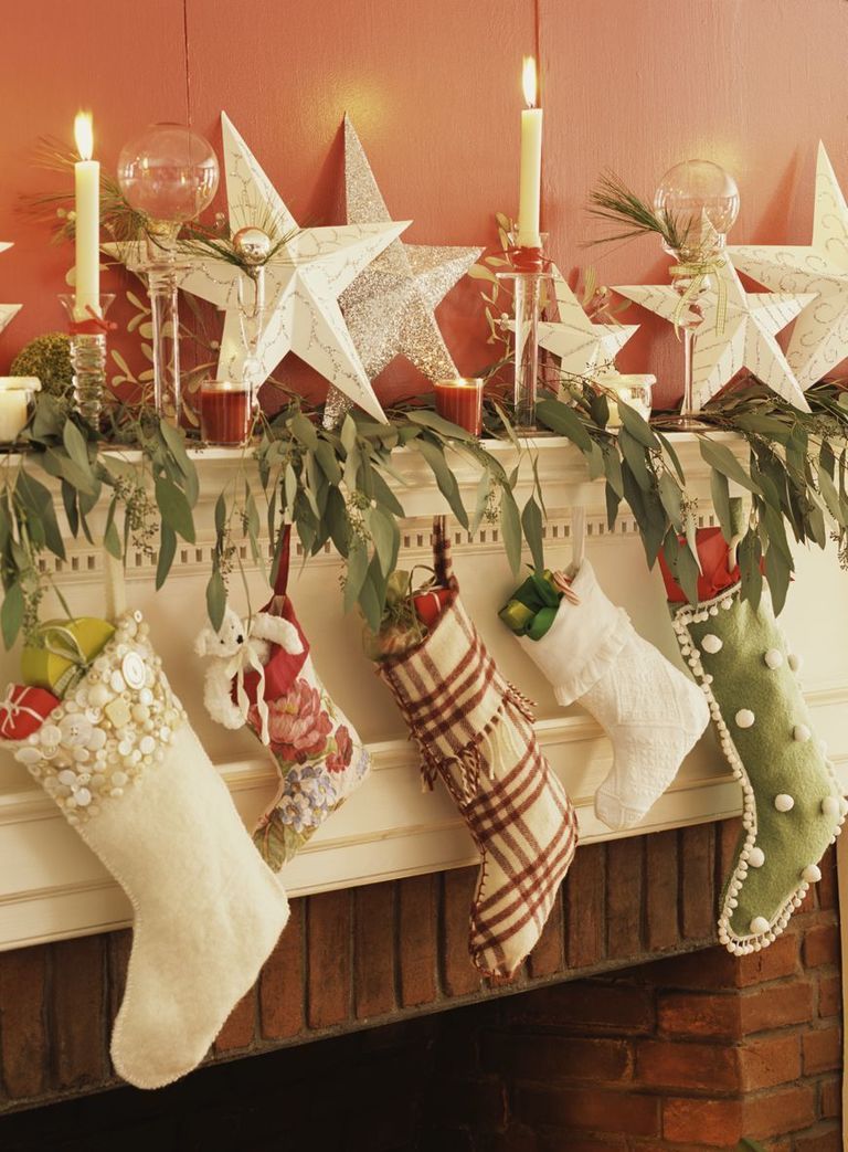 Christmas stocking, Christmas, Interior design, Candle, Christmas eve, Christmas decoration, Ornament, Holiday ornament, Candle holder, Tradition, 