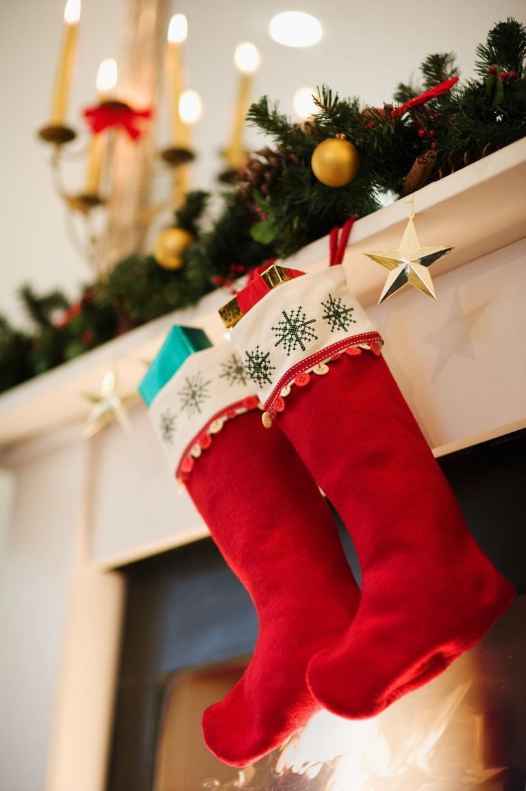 Christmas decoration, Christmas stocking, Interior design, Holiday, Carmine, Christmas eve, Christmas, Costume accessory, Christmas ornament, Holiday ornament, 
